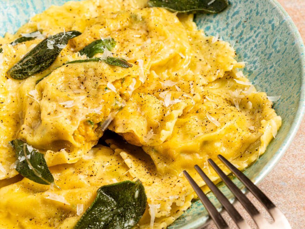 National Ravioli Day!!! Butternut squash stuffed Ravioli with a Sage Brown Butter Sauce. Comforting, Classic and Elevated Dining at its finest.